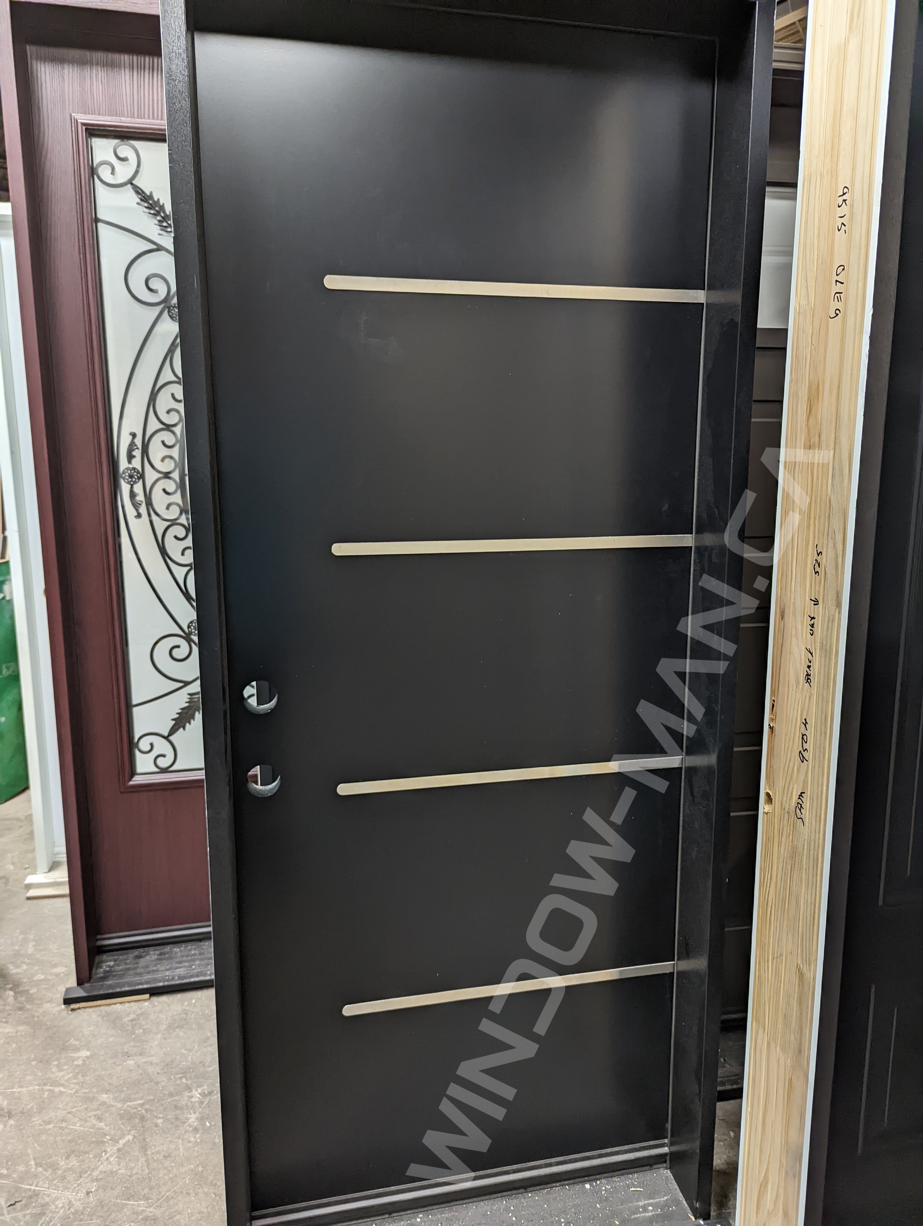 black single steel door with aluminum stripe design