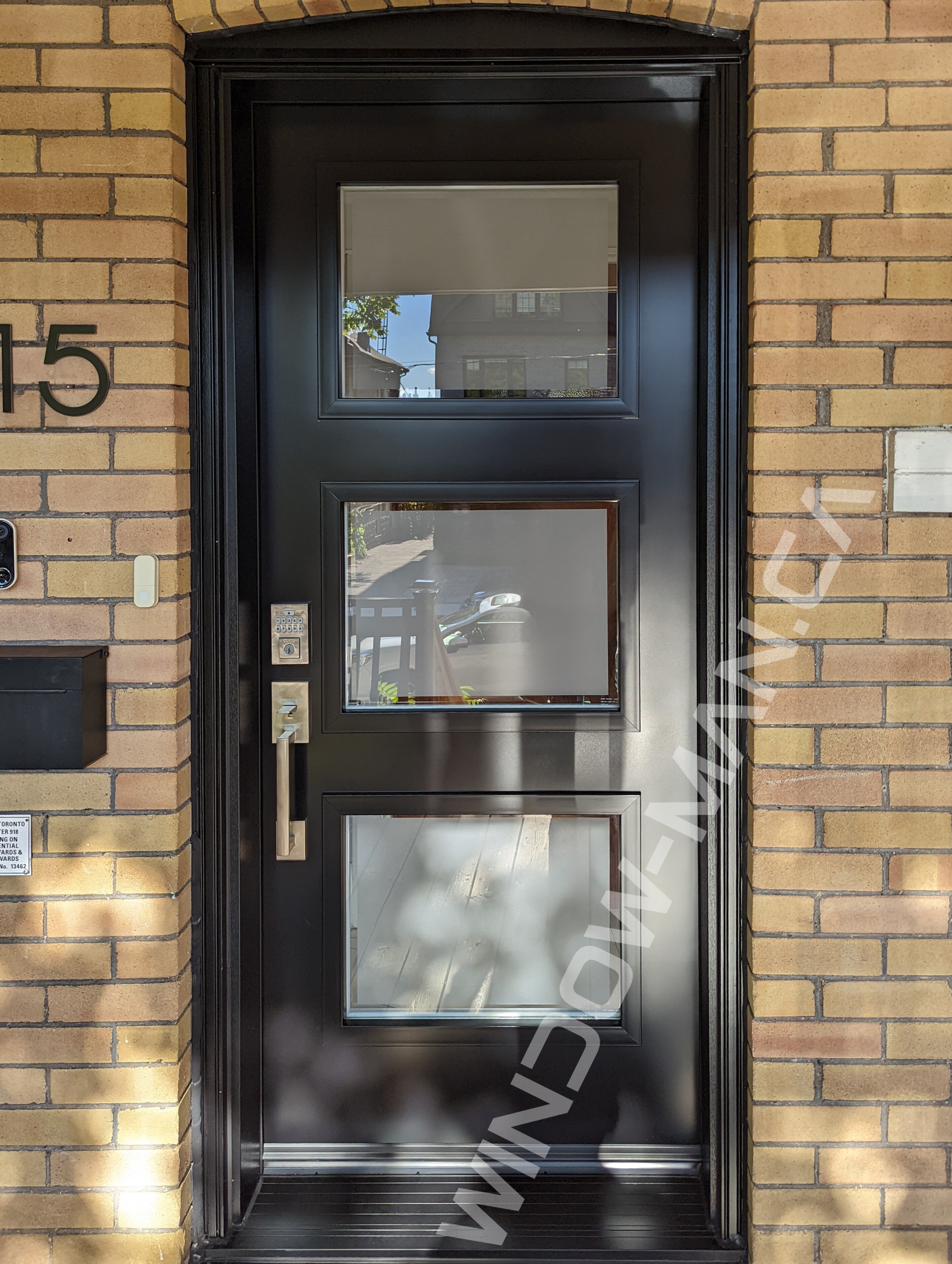 black steel door with clear border glass, smart lock, novatech uno