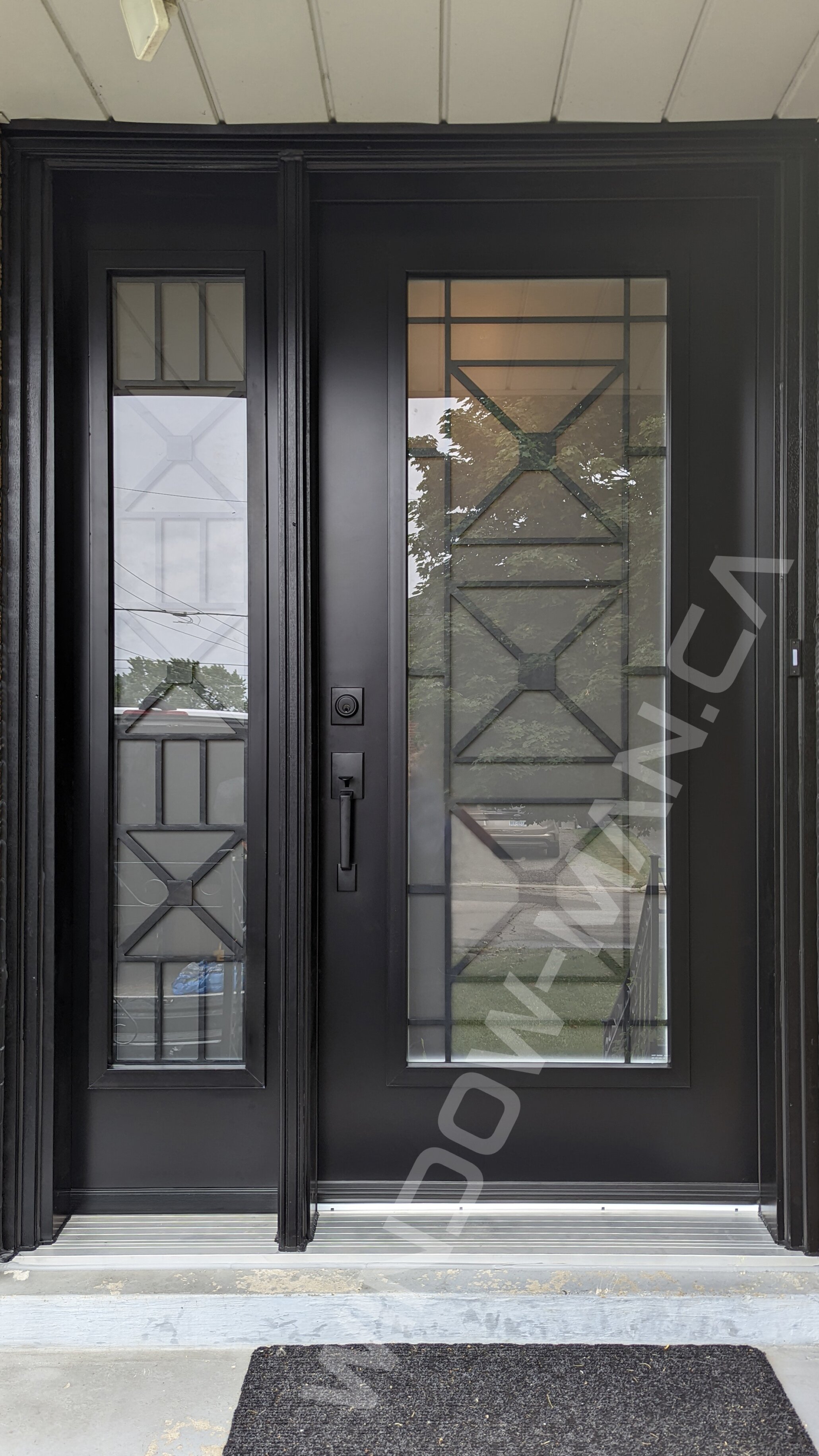 black steel door with sidelight and full century wrought iron glass, wide sidelight