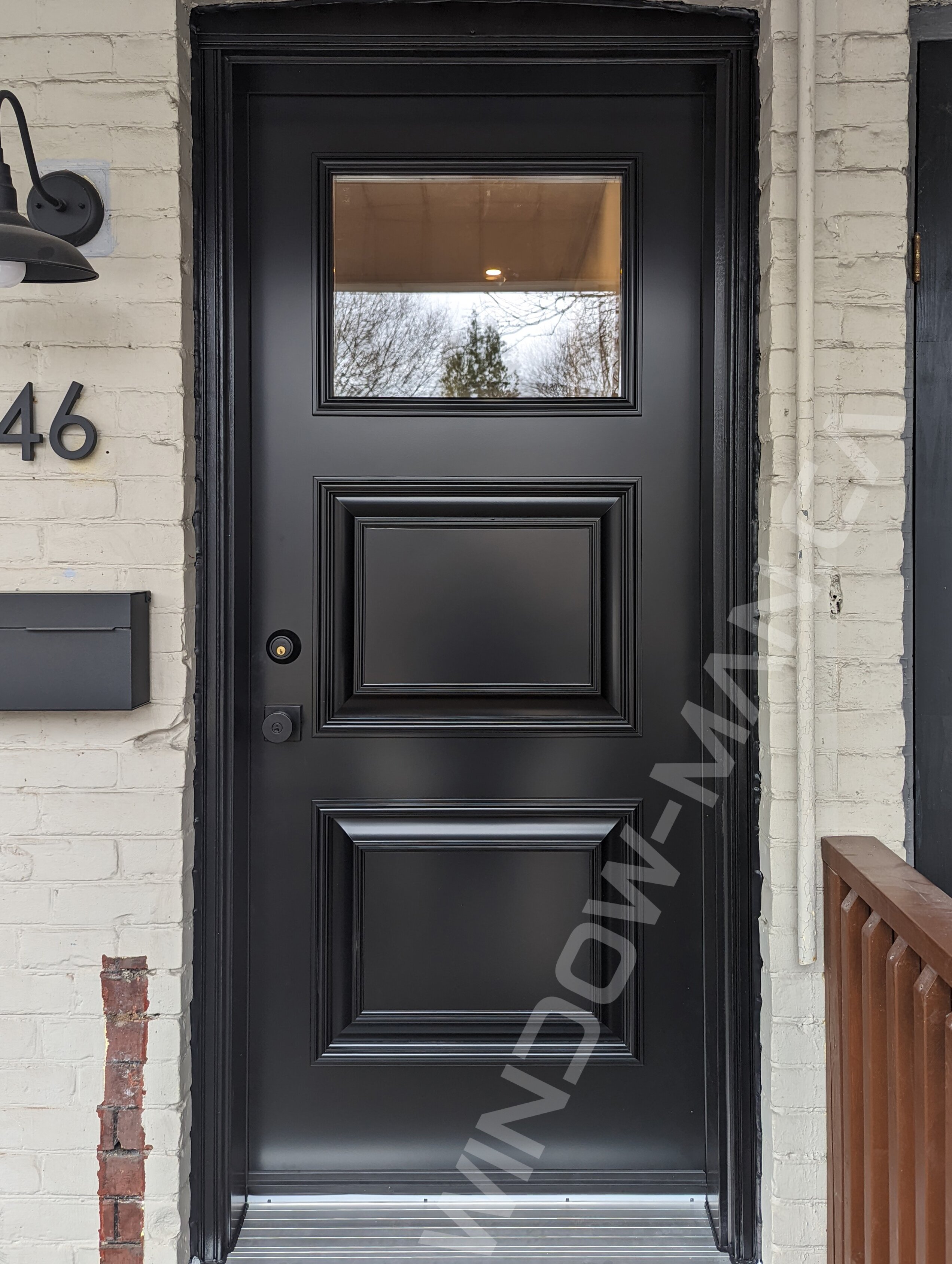 black steel door with small clear glass and executive panels, novatech sydney
