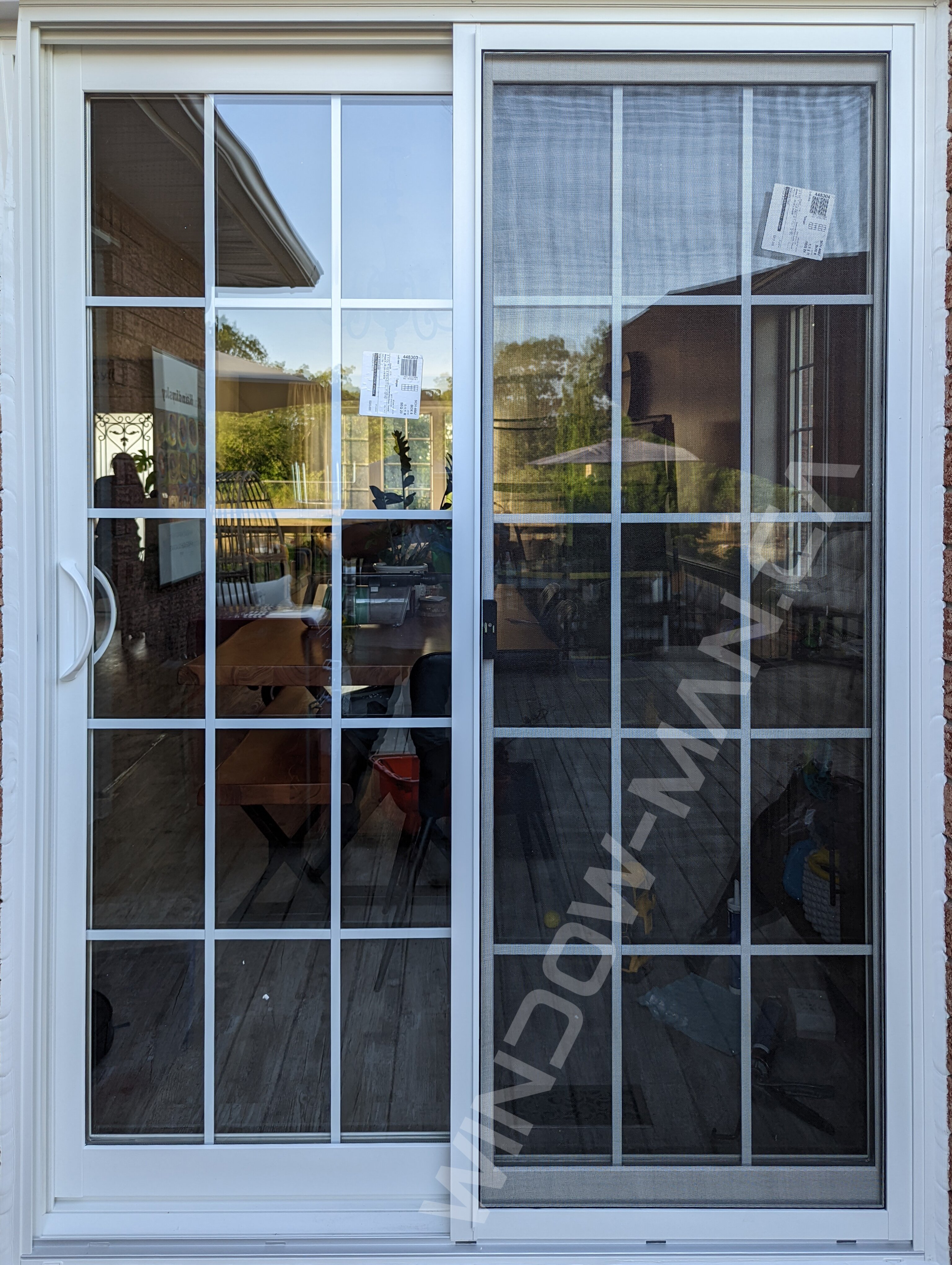sliding vinyl door with full glass and 15 lite 3x5 grid