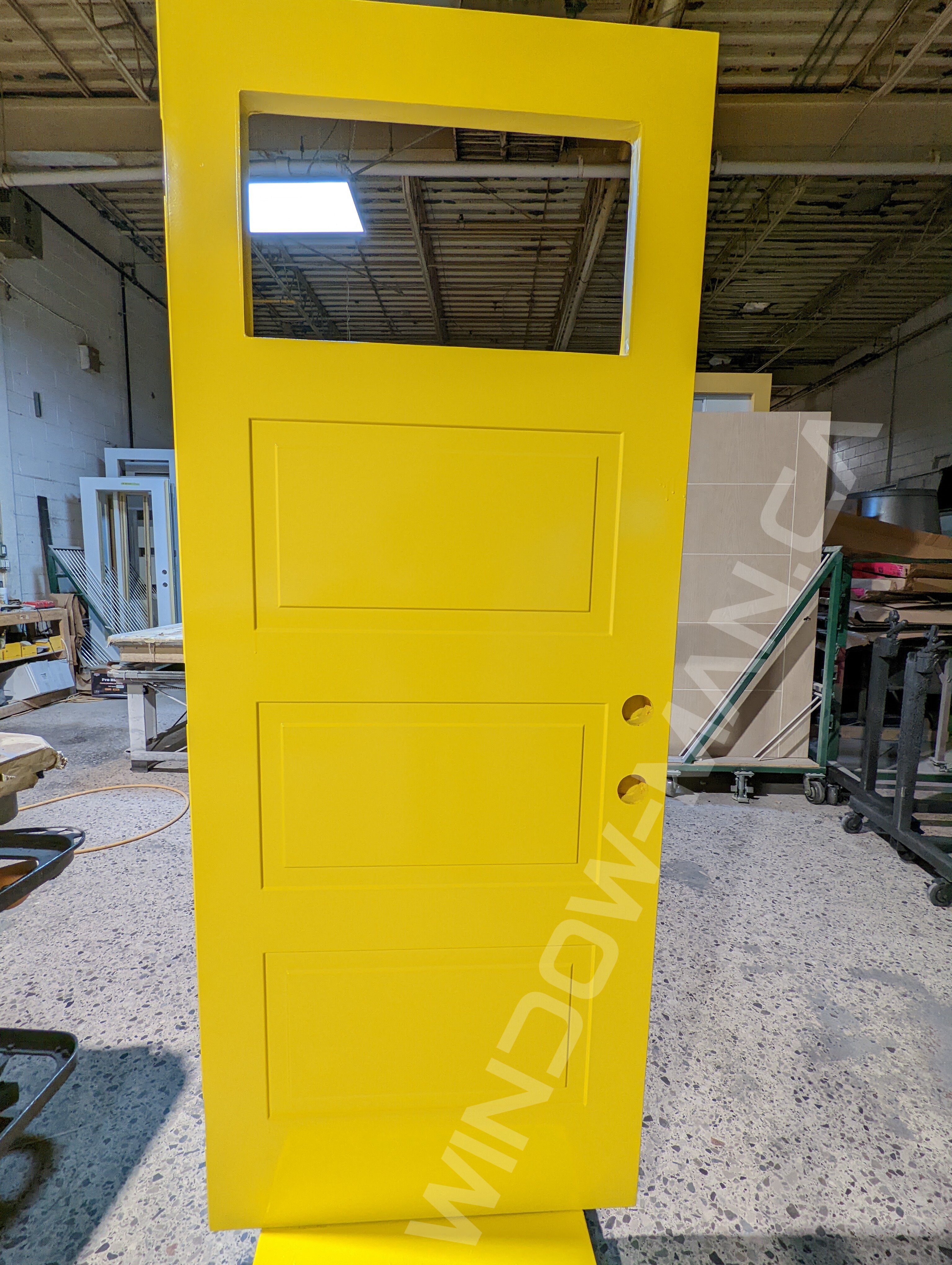yellow steel door with small clear glass, novatech soho