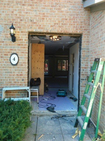8-foot steel double door with 3/4 rochester wrought iron glass - before