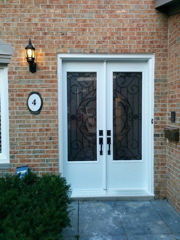 8-foot steel double door with 3/4 rochester wrought iron glass - view from the outside