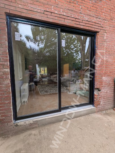 black aluminum sliding door with full clear glass, novatech urbania loft - detailed close up