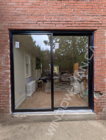black aluminum sliding door with full clear glass, novatech urbania loft - view from the outside