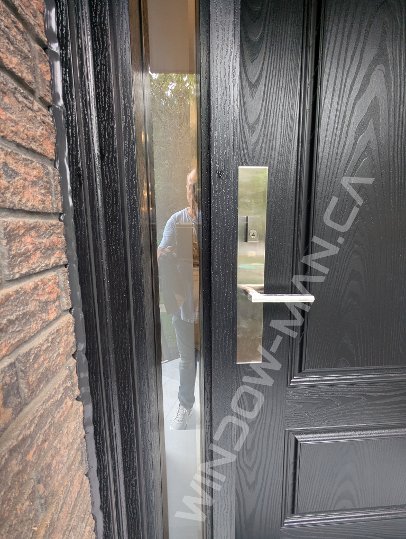 black oak grain fiberglass door with sidelights and acid etched glass, narrow sidelights, 2 panel, multipoint lock - detailed close up