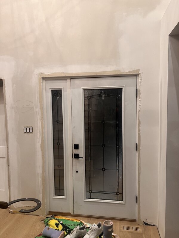 black fiberglass door with sidelight and clear border glass, wide sidelight, smart lock - before