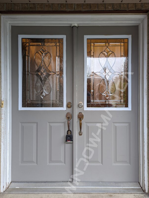 black oak grain fiberglass door with sidelights and acid etched glass, groove design, multipoint lock - before-after