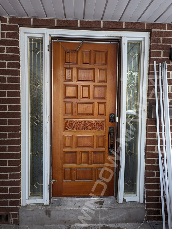 black oak grain fiberglass door with sidelights and clear border glass, 2 panel, multipoint lock - before-after
