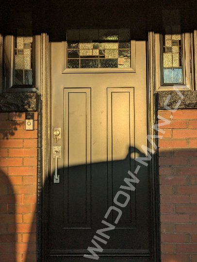 black steel craftsman door with side windows and santa fe stained glass, 2 panel