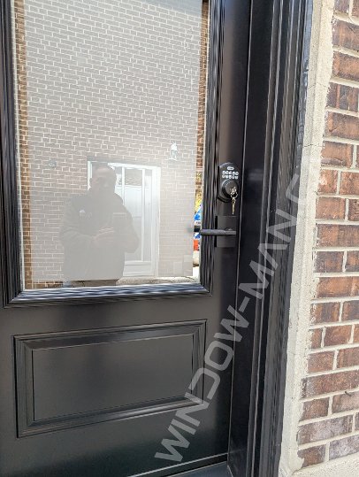 black steel door with 3/4 clear border glass, smart lock - detailed close up