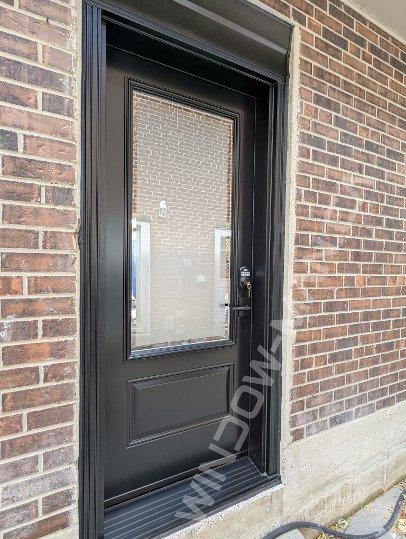 black steel door with 3/4 clear border glass, smart lock - view from the outside