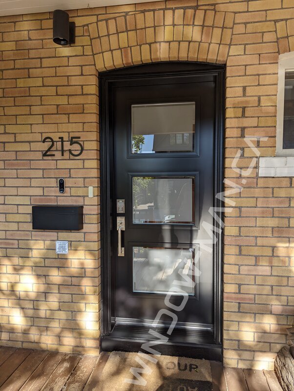 black steel door with clear border glass, smart lock, novatech uno - view from the outside