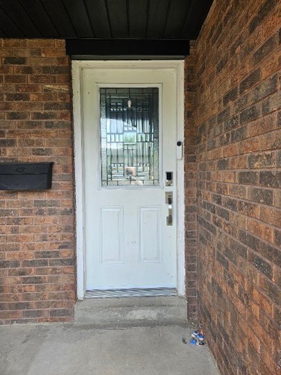black steel door with full oak ridge wrought iron glass, smart lock - before-after