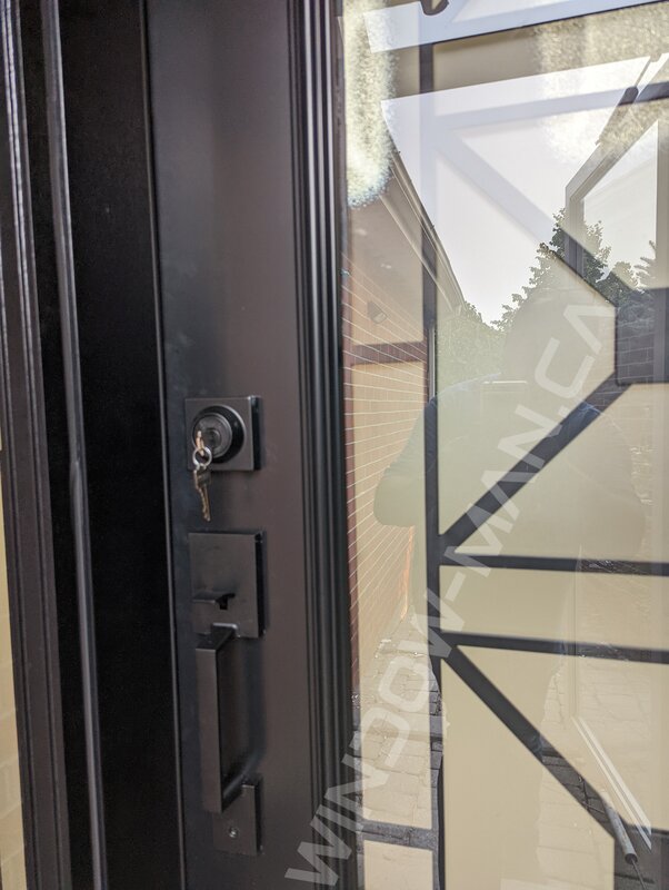 black steel door with sidelight and full century wrought iron glass - detailed close up