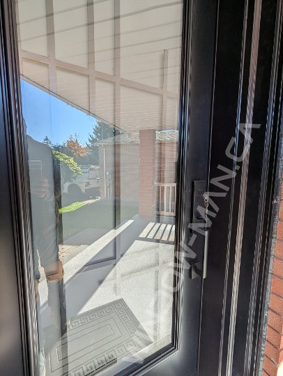 black steel door with sidelight and full pasadena wrought iron glass - detailed close up