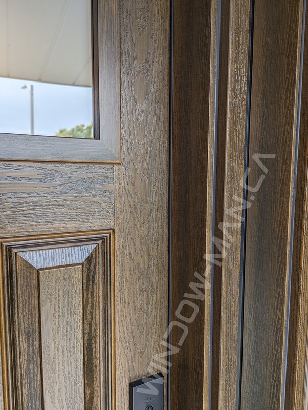 brown oak grain fiberglass craftsman door with sidelight and acid etched sdl glass - detailed close up