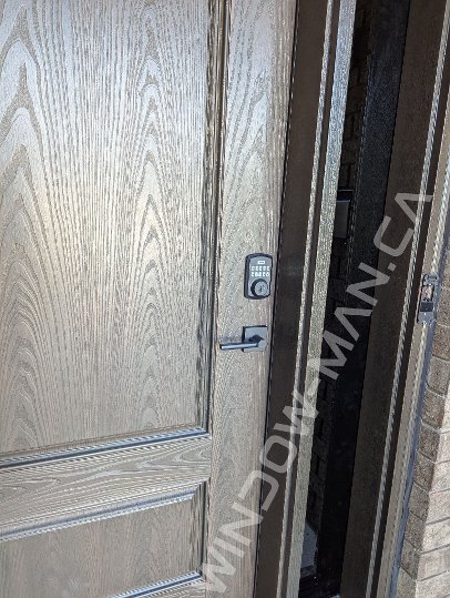 brown oak grain fiberglass door with sidelights and super grey glass, 8-foot, multipoint lock - before