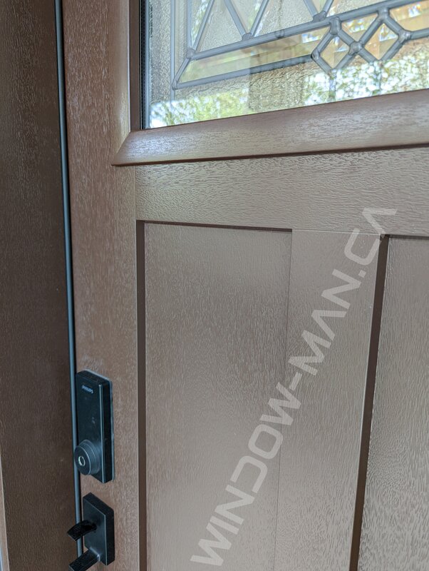 nutmeg fiberglass craftsman door with small cookstown stained glass, mahogany grain, 3 panel - detailed close up