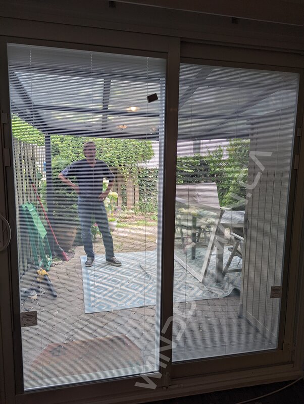sliding vinyl door with full glass and mini blinds - view from the inside
