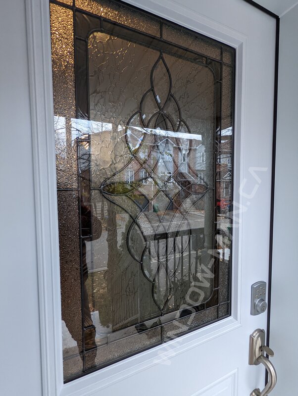 steel door with half northbay stained glass, smart lock - detailed close up