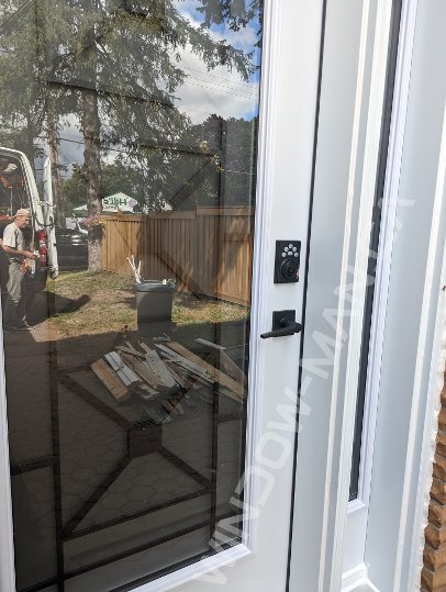 steel door with sidelight and full century wrought iron glass, smart lock - detailed close up