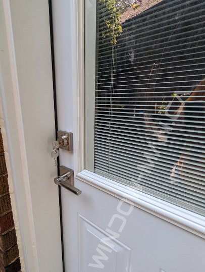 steel short door with half clear glass and mini blinds - detailed close up