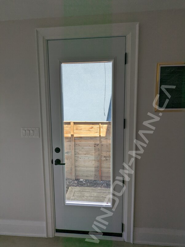 steel tall narrow door with full clear glass - view from the inside